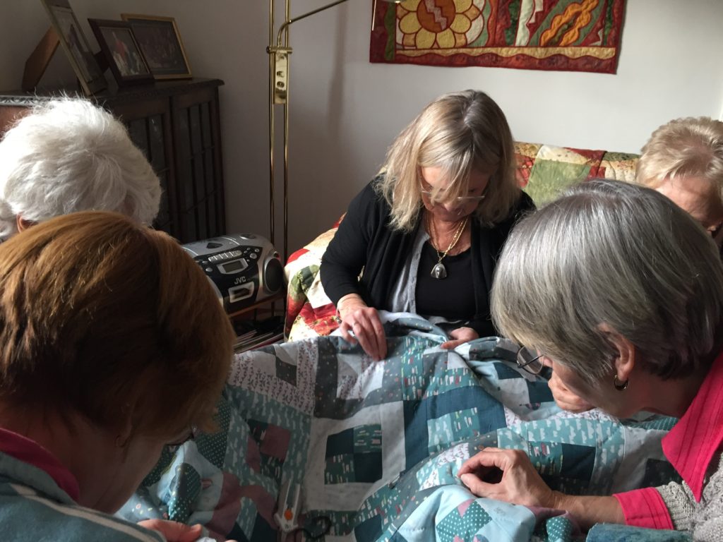 Riverside Quilters group working on a quilt for the Grenfell Tower Appeal