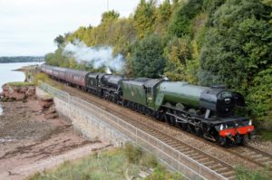 Steam train on riverside line