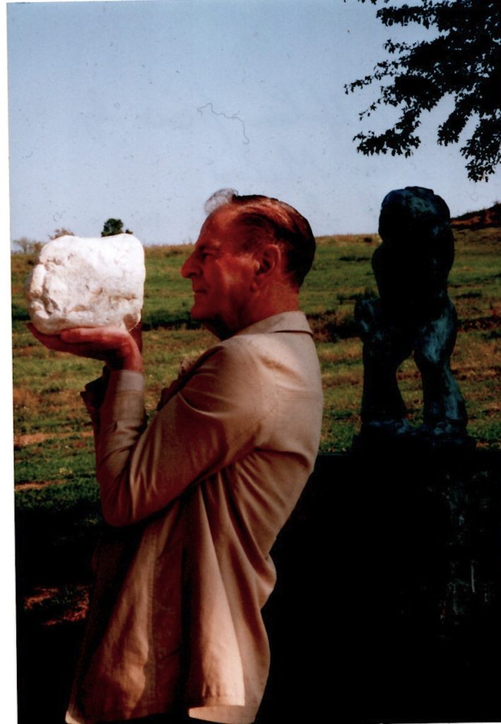 Philip Gourd with "Sculpture piece by Dino Milani with his Pieta in background, Monte Sole, Sept 1998".