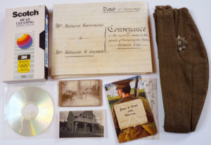 Photograph of a selection of archive material from the Bishopsteignton Heritage collection.