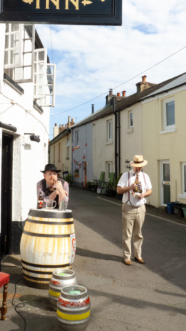 Hats and Pipes - looking very comfortable prior to decorating the pub - VE Day 75