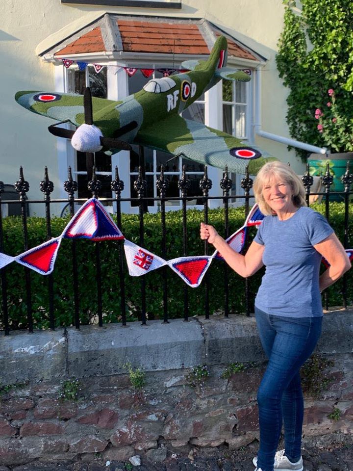 Poster girl Caroline with her knitted spitfire