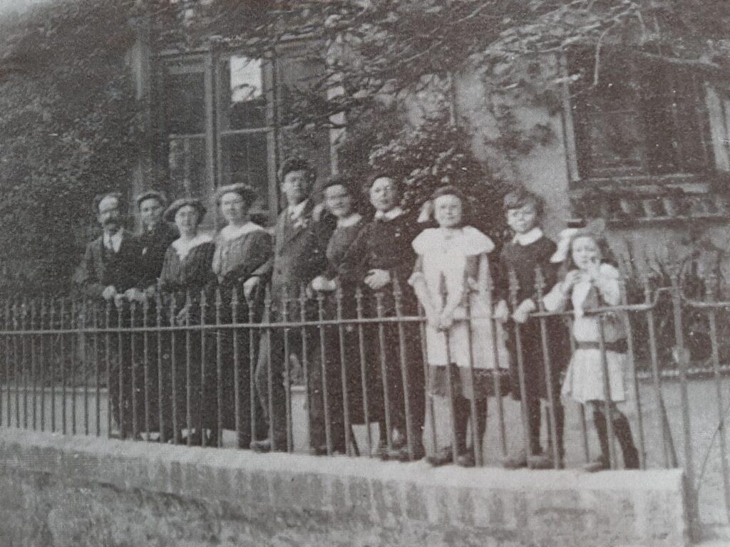 Clifford Wallis and his family outside of Bishopsteignton School c 1914