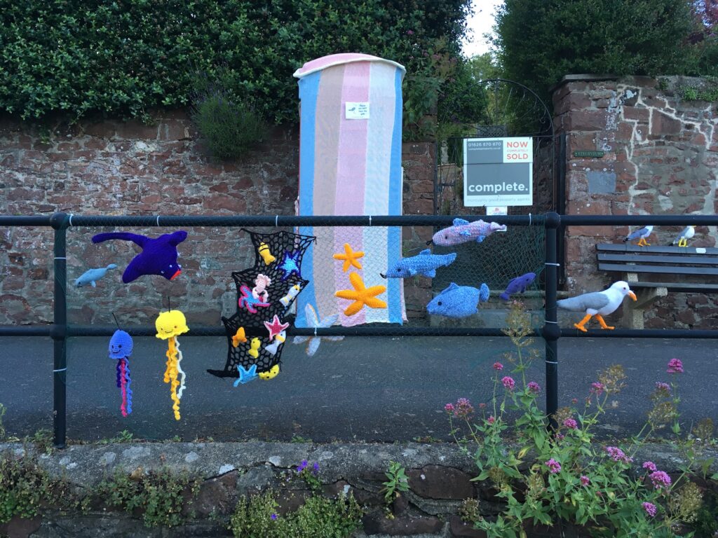 A yarn bombed telephone box