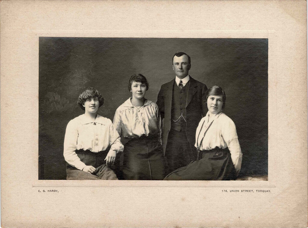 Photograph of Grace Coombe née Loud (centre left) with 2 unidentified women and an unidentified man.