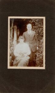 Photograph of Grace Coombe née Loud with a cat and Philip Coombe, around 1925.