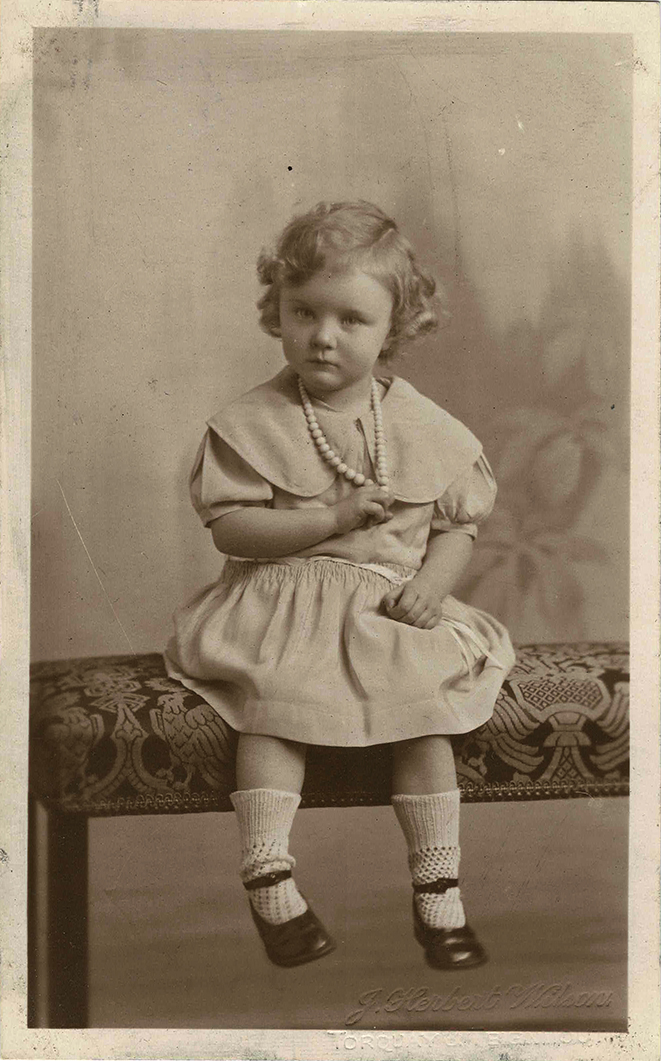 Postcard photograph of Molly Coombe age 3, front.