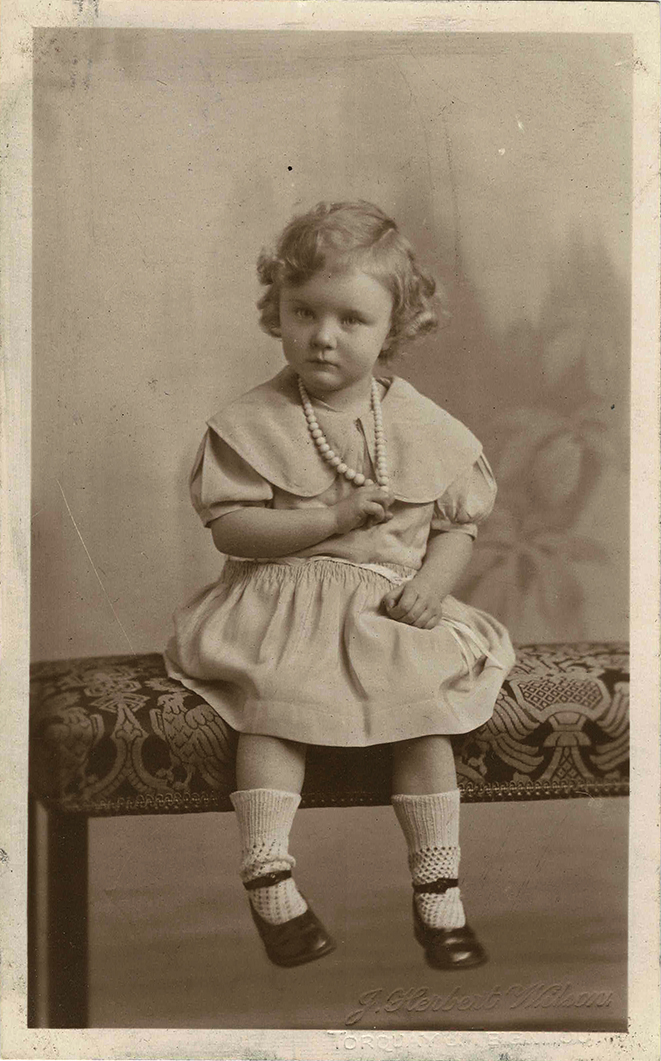 Postcard photograph of Molly Coombe age 3, front Postcard photograph of Molly Coombe age 3, front.
