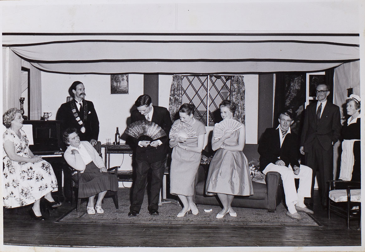 Photograph of cast members playing a scene in the play 'The Blue Goose' presented by Bishopsteignton Players in 1961