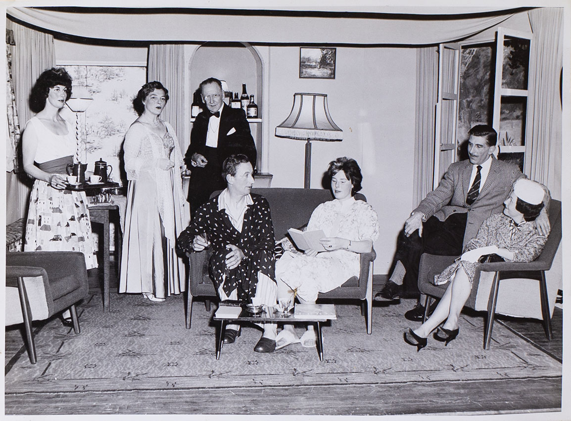 Photograph of the cast in a scene from the play 'Wolf's Clothing' presented by Bishopsteignton Players in the Village Hall 1964