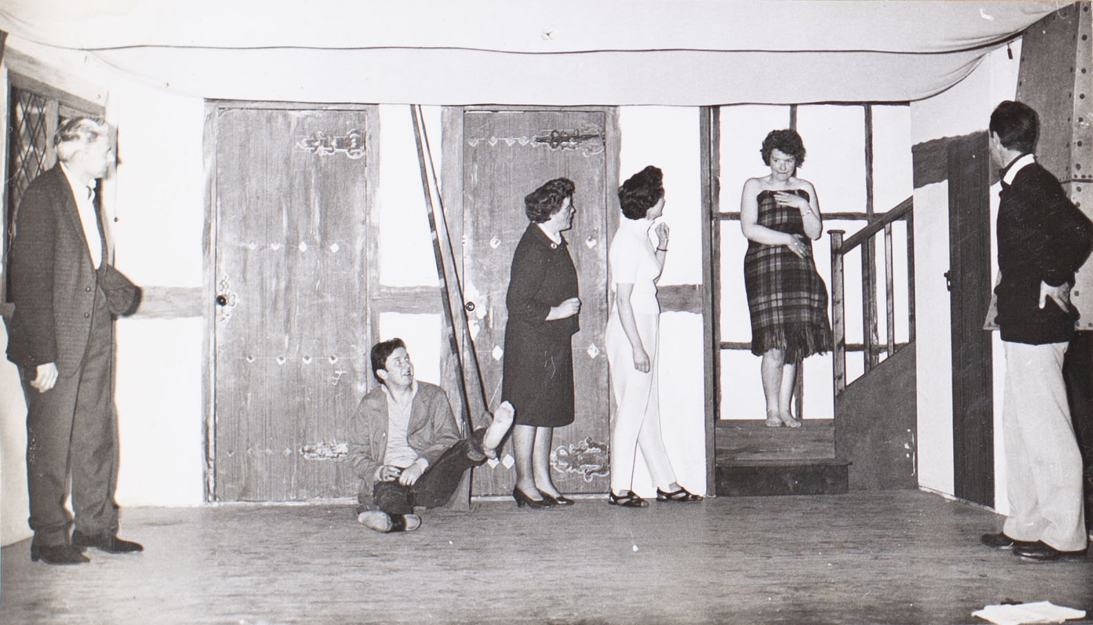 Photograph of the cast in a scene from the play 'Here We Come Gathering' presented by Bishopsteignton Players