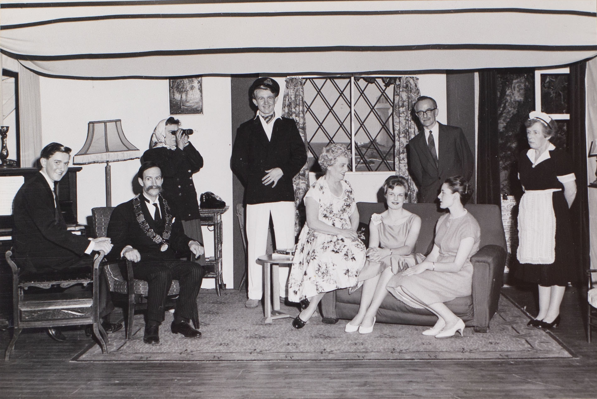 Photograph of actors in a scene from the 1960s play 'Blue Goose' performed by the Bishopsteignton Players