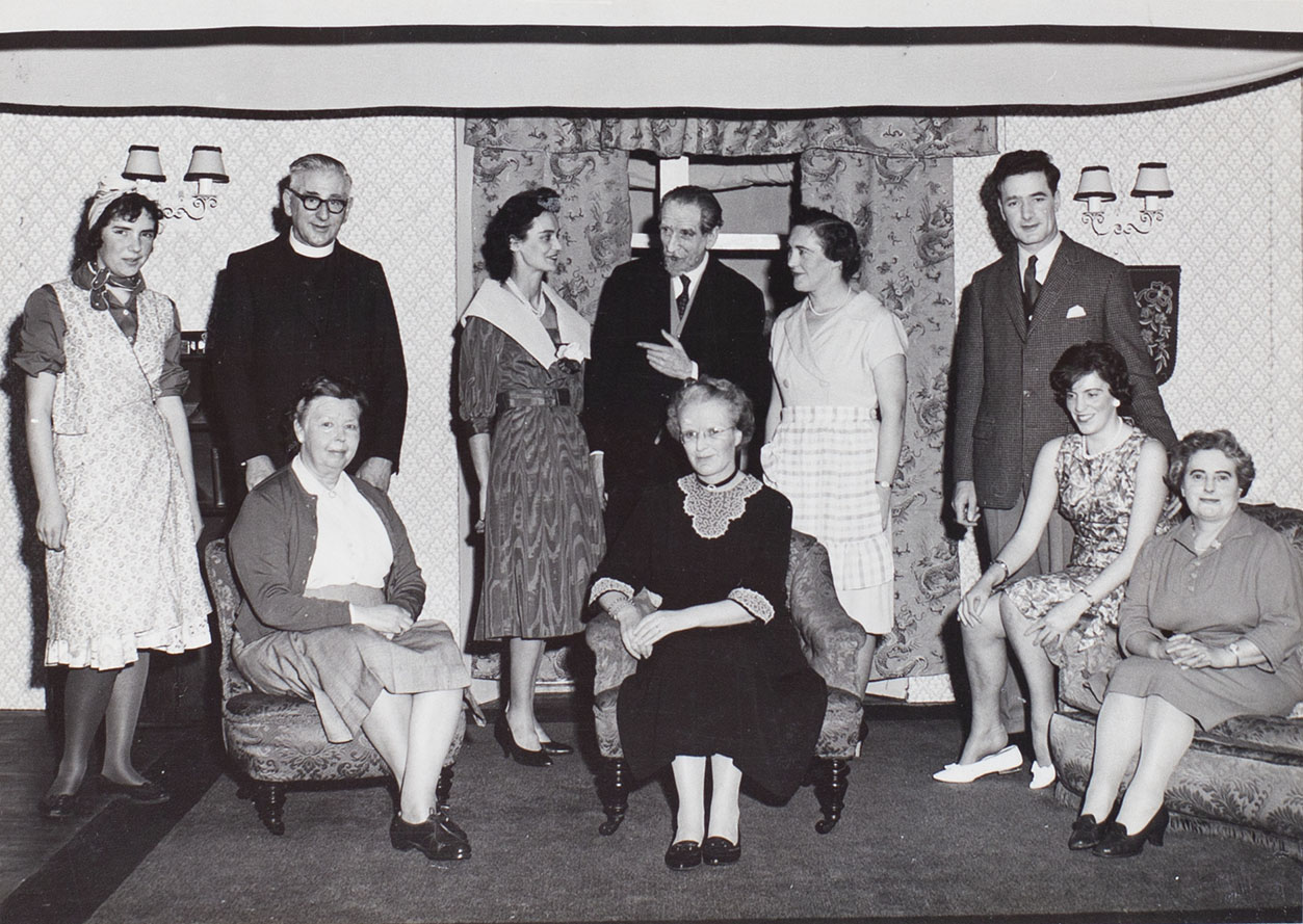 Photograph of actors in a scene from the 1960s play 'Akin to Love' performed by the Bishopsteignton Players