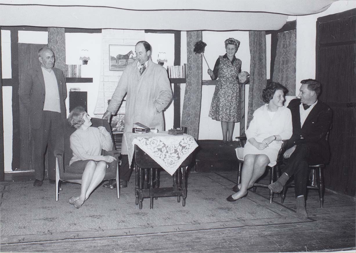 Photograph of actors in a scene from the play 'Intent to Murder' performed by the Bishopsteignton Players in the 1960s