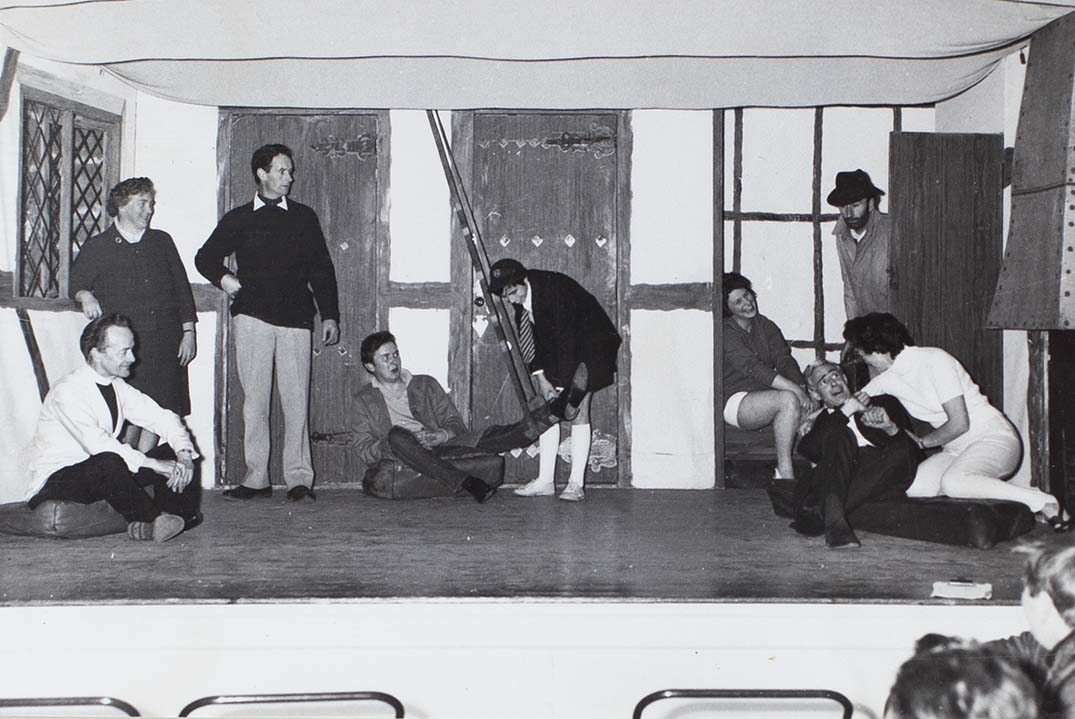 Photograph of actors in a scene from the play 'Here We Come Gathering' performed by the Bishopsteignton Players in the 1960s