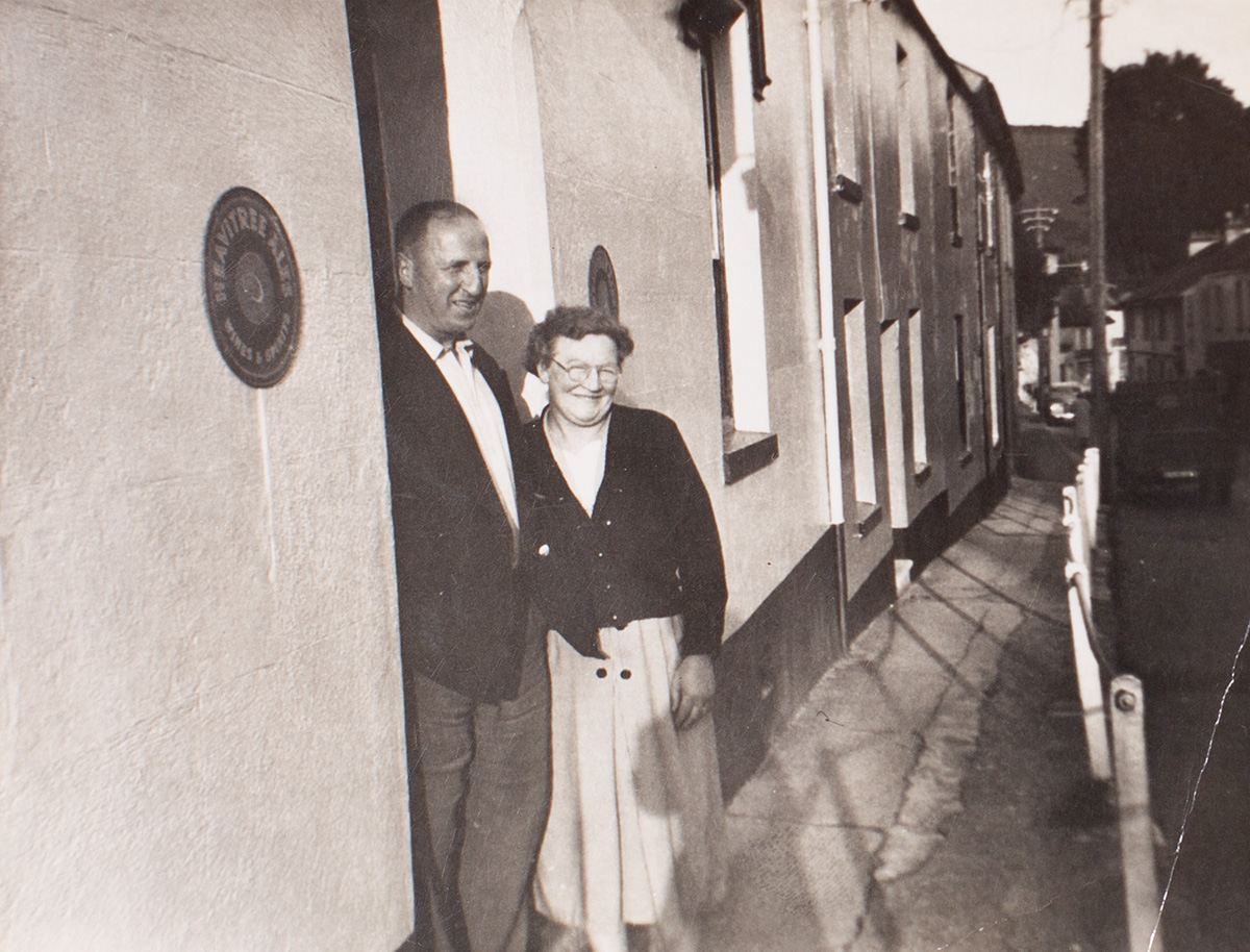 Photograph of two named persons outside the Manor Inn