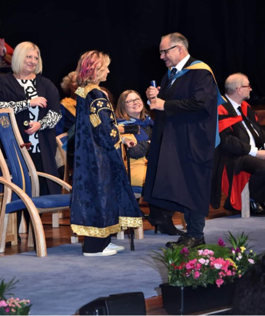 Photograph shows Tim Newton receiving his Batchelors Degree (BA hons) in Forensic Psychology in 2020.