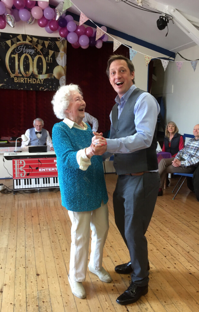 Photograph of Mary Overill (nèe Bovey) dancing at her 100th party 2022